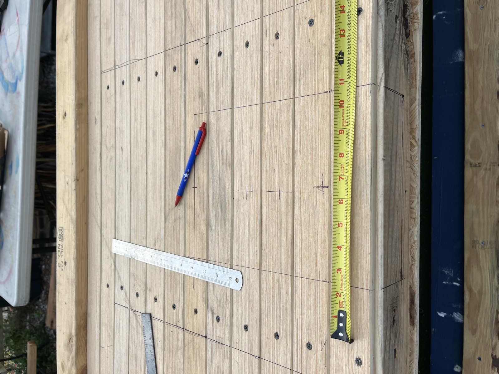 Mixer cutout layout — measured and marked in pencil on the table top